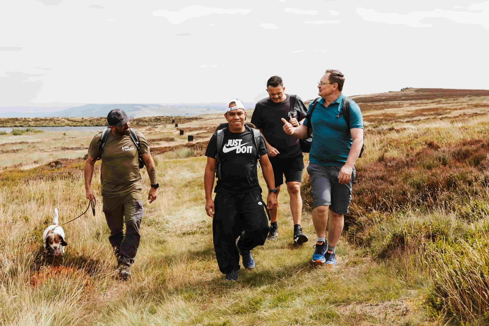 A team working together during a Hike Yorkshire corporate day on the moors