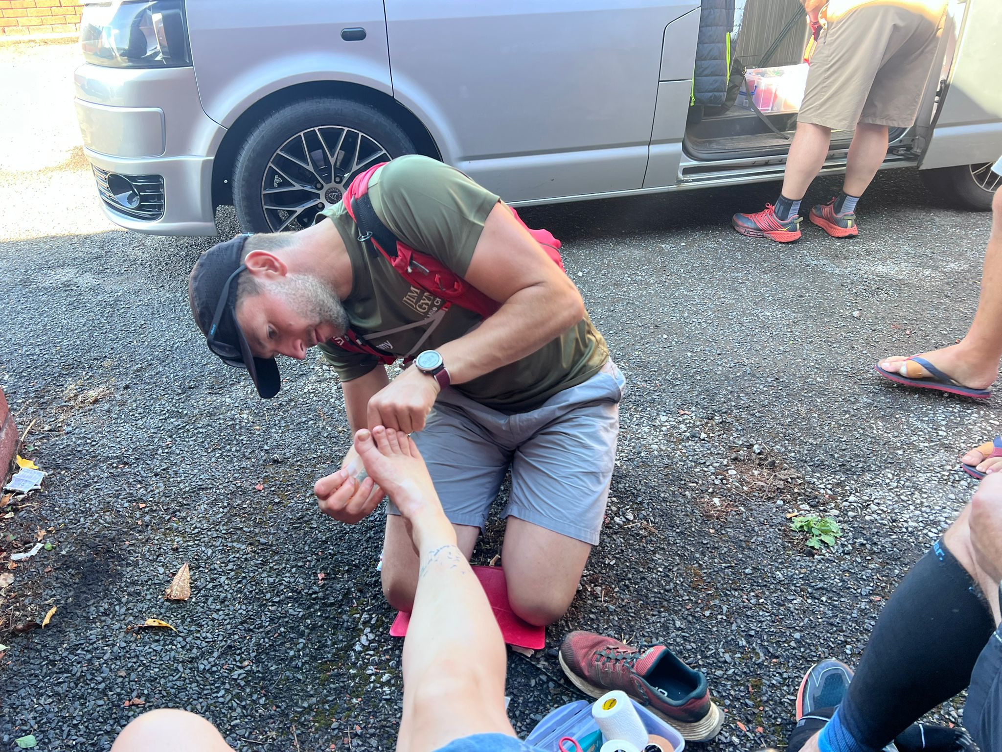 Jimmy helping hikers on a trail