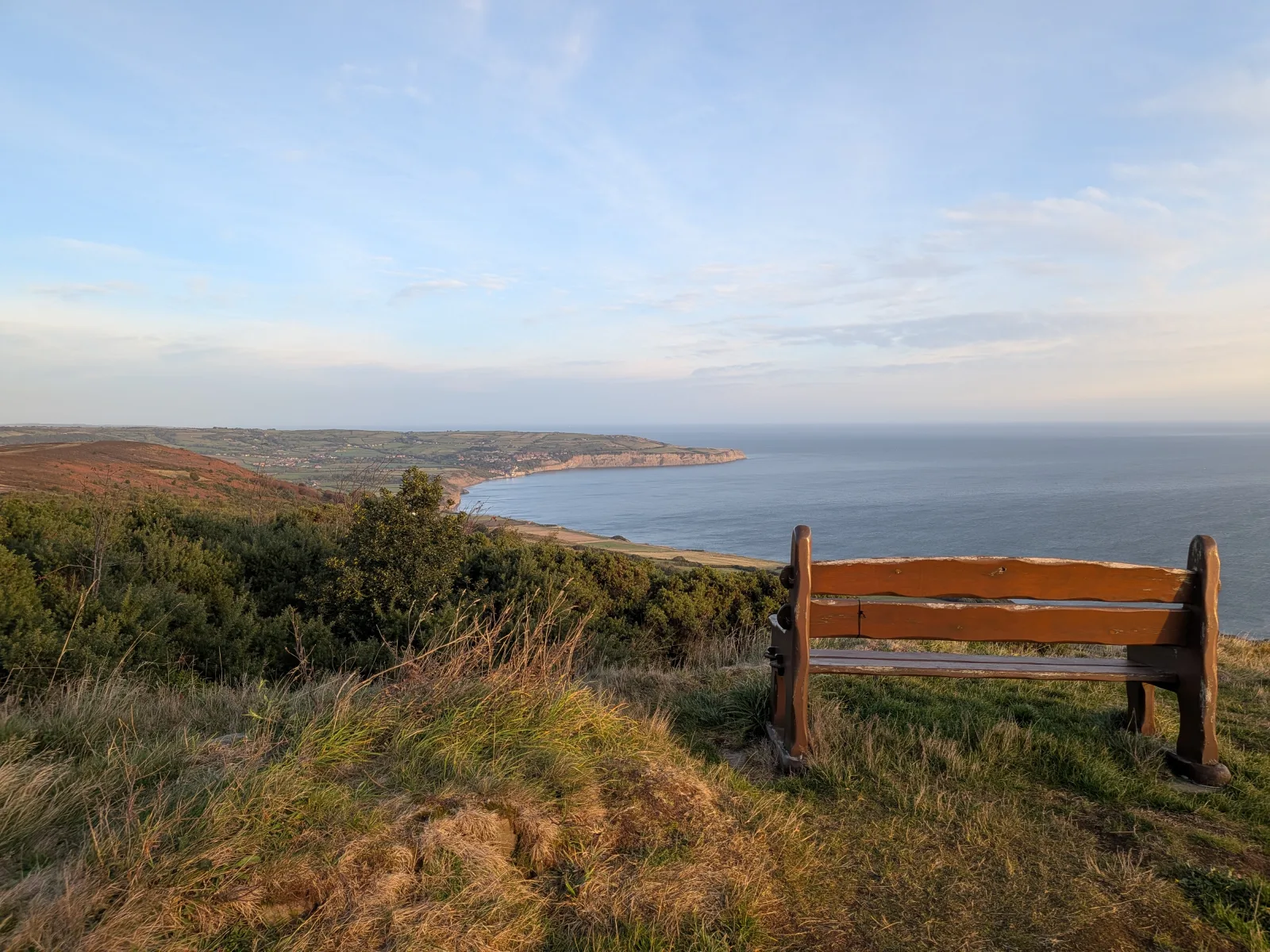 A wooden bench looking out over the Yorkshire coastline